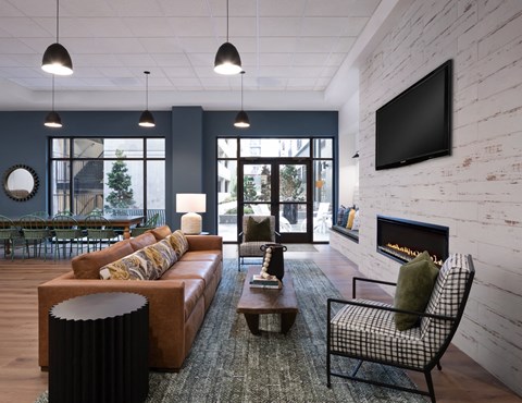 a living room with a couch and a fireplace and a television